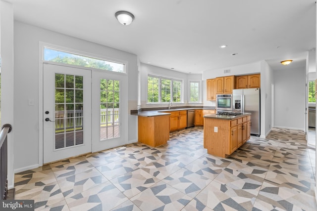 601 James Ridge Rd, Bowie, MD 20721 - kitchen with appliances with stainless steel finishes, a sink, a center island, recessed lighting, and baseboards