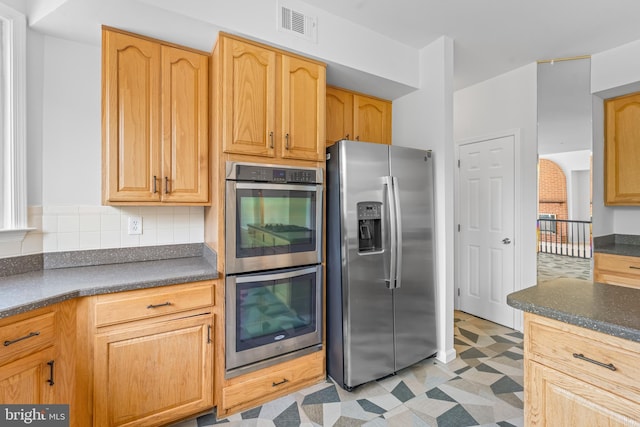 601 James Ridge Rd, Bowie, MD 20721 - kitchen with stainless steel appliances, dark countertops, light floors, and tasteful backsplash