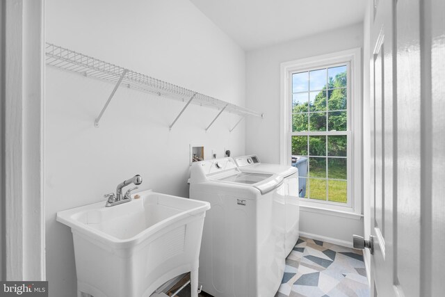 601 James Ridge Rd, Bowie, MD 20721 - laundry area featuring washer and dryer, plenty of natural light, and light floors