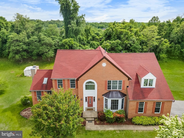 601 James Ridge Rd, Bowie, MD 20721 - view of front facade featuring brick siding, a front lawn, and a wooded view