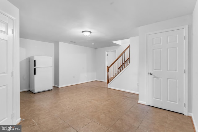 601 James Ridge Rd, Bowie, MD 20721 - spare room featuring stairs, baseboards, and light tile patterned floors