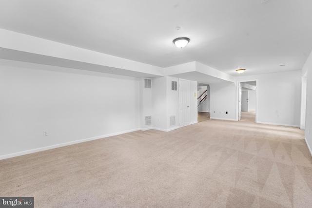 601 James Ridge Rd, Bowie, MD 20721 - unfurnished living room featuring light carpet, stairway, and baseboards