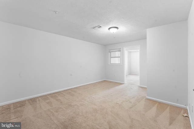 601 James Ridge Rd, Bowie, MD 20721 - spare room with carpet floors, baseboards, and a textured ceiling