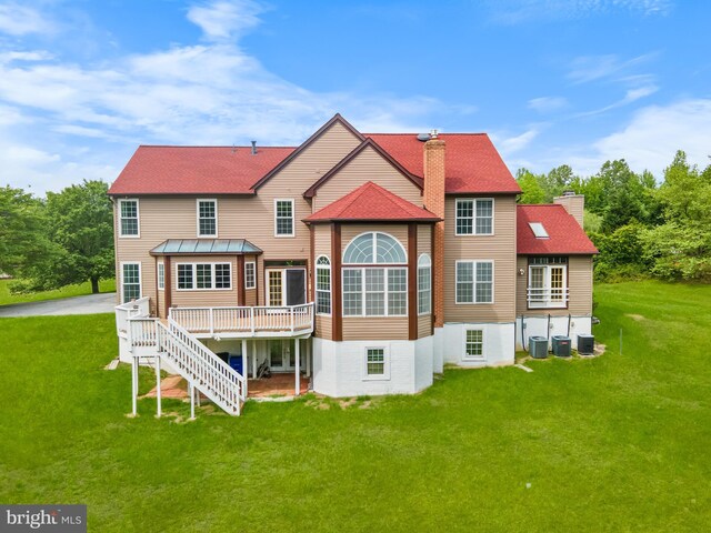 601 James Ridge Rd, Bowie, MD 20721 - back of house with a chimney, a wooden deck, a yard, and cooling unit