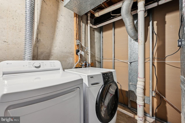 laundry room featuring washing machine and dryer