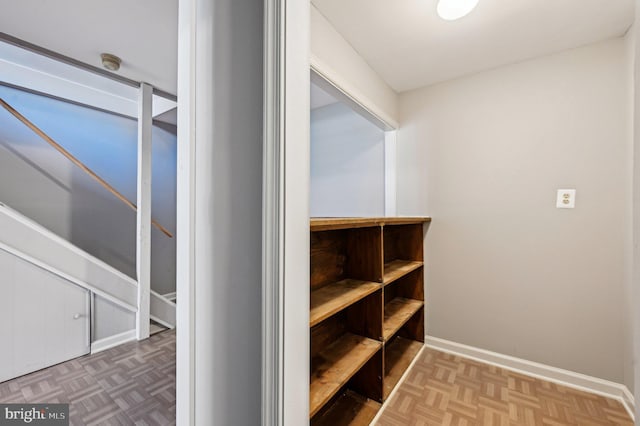 hall featuring baseboards