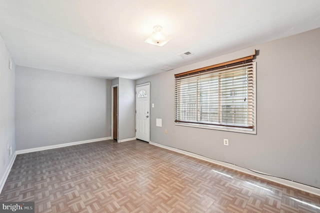 empty room with baseboards