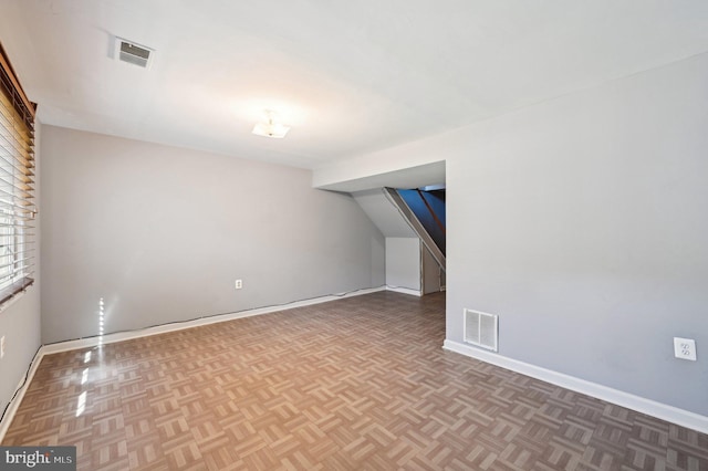 bonus room featuring baseboards