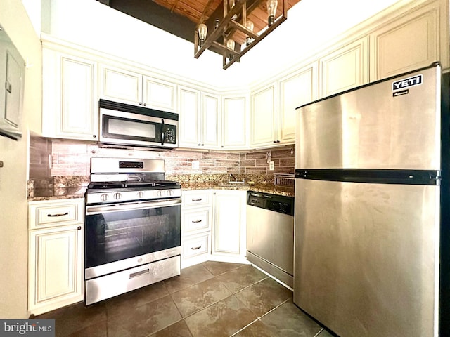 7839 Enola St Unit 204, Mclean, VA 22102 - kitchen featuring appliances with stainless steel finishes, cream cabinetry, and tasteful backsplash