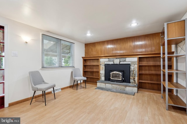 living room with baseboards, recessed lighting, visible vents, and wood finished floors