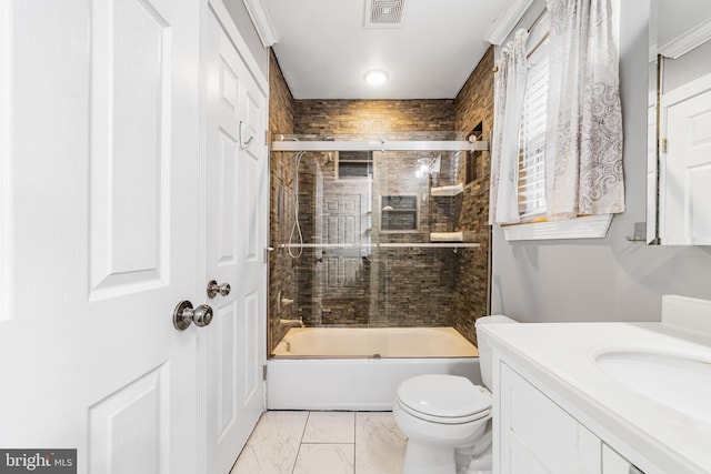 bathroom featuring toilet, bath / shower combo with glass door, vanity, and marble finish flooring