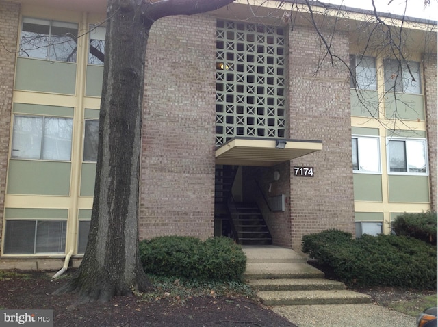 view of building exterior featuring stairs