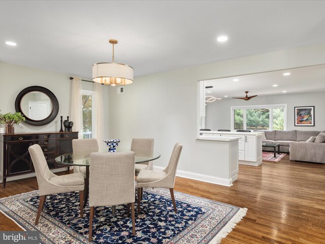 dining room with wood finished floors, recessed lighting, baseboards, and ceiling fan