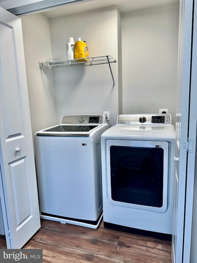 304 1st St, Colonial Beach, VA 22443 - washroom with washing machine and clothes dryer, laundry area, and wood finished floors