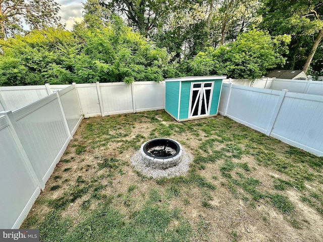 304 1st St, Colonial Beach, VA 22443 - view of yard featuring a fenced backyard, an outdoor structure, and a storage shed