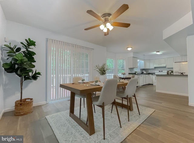411 N Ln, Prince Frederick, MD 20678 - dining space featuring a ceiling fan, light wood finished floors, and baseboards