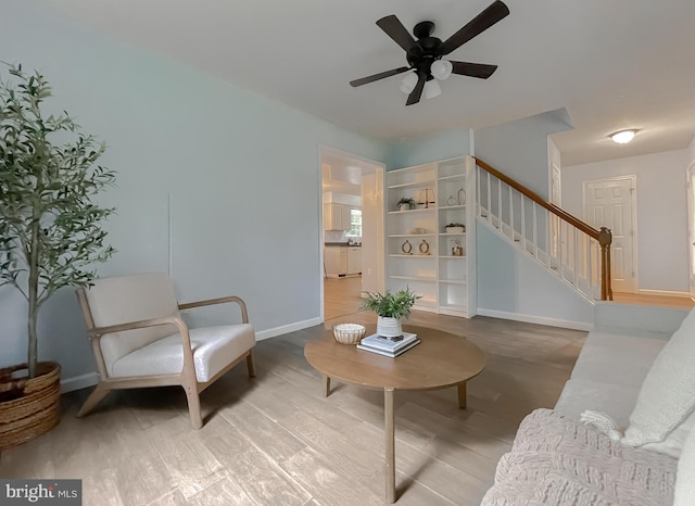 411 N Ln, Prince Frederick, MD 20678 - living area with stairs, baseboards, a ceiling fan, and wood finished floors