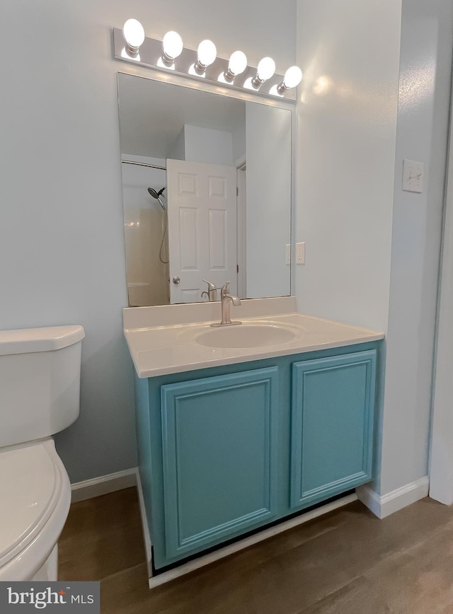 411 N Ln, Prince Frederick, MD 20678 - bathroom with toilet, baseboards, vanity, and a shower