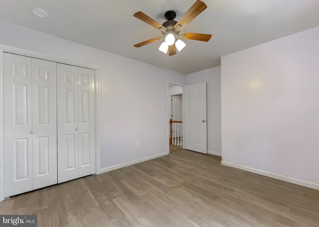 411 N Ln, Prince Frederick, MD 20678 - unfurnished bedroom with baseboards, light wood-style floors, a closet, and ceiling fan