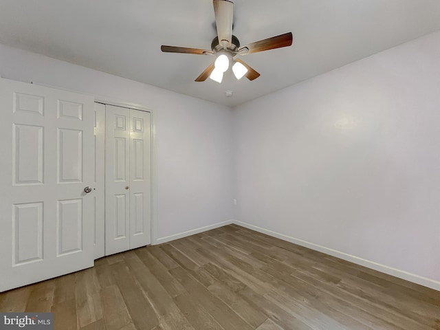 411 N Ln, Prince Frederick, MD 20678 - unfurnished bedroom featuring wood finished floors, baseboards, a closet, and ceiling fan