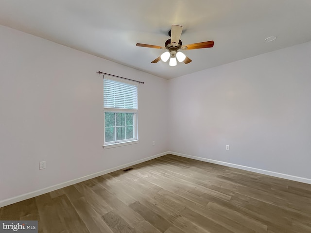411 N Ln, Prince Frederick, MD 20678 - empty room with wood finished floors, baseboards, and a ceiling fan