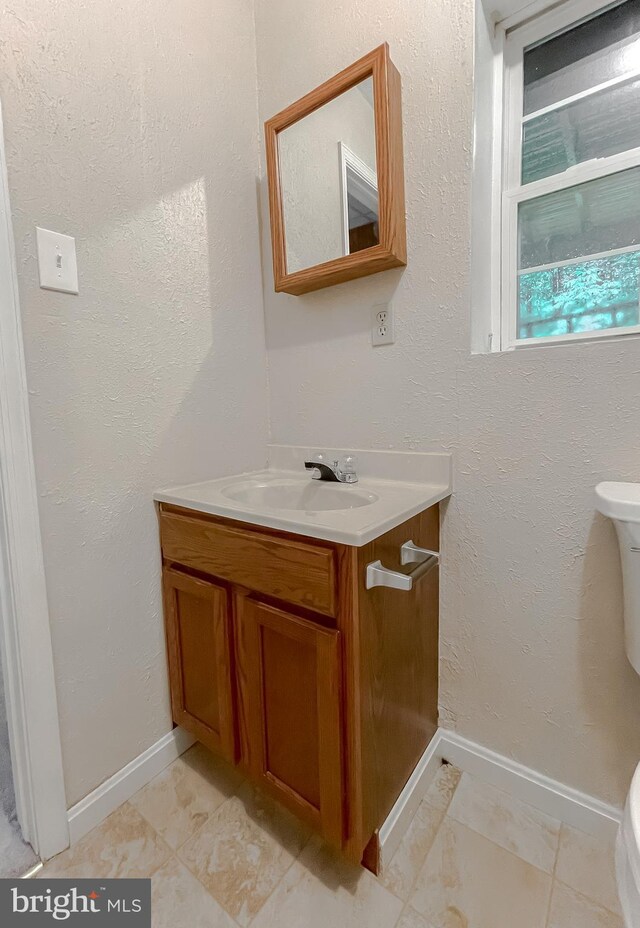 411 N Ln, Prince Frederick, MD 20678 - bathroom with toilet, vanity, and baseboards