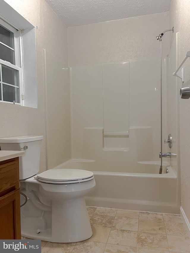 411 N Ln, Prince Frederick, MD 20678 - full bathroom featuring toilet, a textured ceiling,  shower combination, a textured wall, and vanity