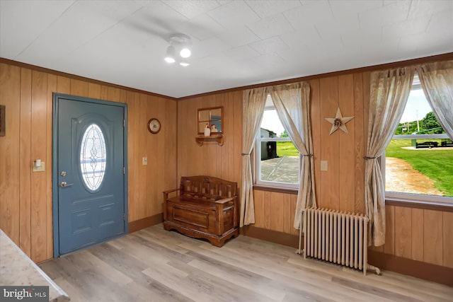 2050 Legion Rd, Clearfield, PA 16830 - foyer featuring wood finished floors, radiator heating unit, and wooden walls