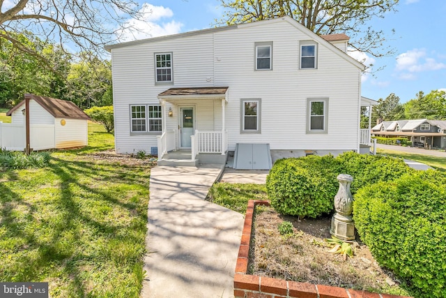 7371 Mountain Laurel Rd, Boonsboro, MD 21713 - traditional-style house with an outdoor structure, a shed, and a front lawn