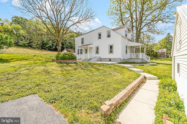 exterior space with a yard and a porch