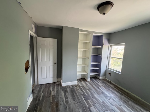 1505 Ramsay St, Baltimore, MD 21223 - unfurnished bedroom featuring baseboards and dark wood-style floors
