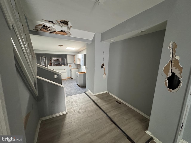 1505 Ramsay St, Baltimore, MD 21223 - hallway featuring baseboards and wood finished floors