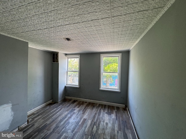 1505 Ramsay St, Baltimore, MD 21223 - empty room with an ornate ceiling, baseboards, and wood finished floors