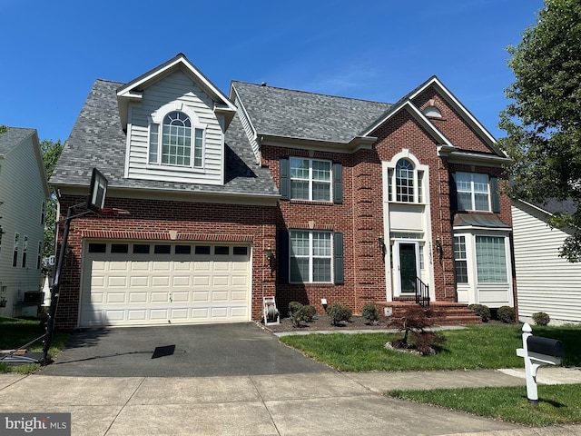 11404 Ramsburg Ct, North Potomac, MD 20878 - view of front facade with asphalt driveway, brick siding, a shingled roof, a garage, and a front lawn