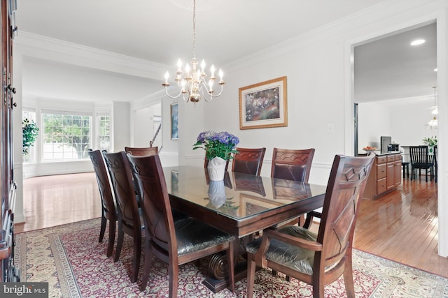 11404 Ramsburg Ct, North Potomac, MD 20878 - dining room featuring a chandelier, crown molding, light wood-style flooring, and recessed lighting