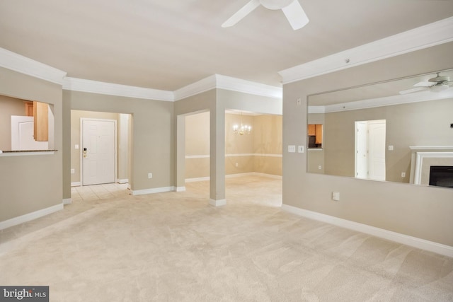 unfurnished living room with crown molding, a fireplace, baseboards, carpet flooring, and ceiling fan with notable chandelier