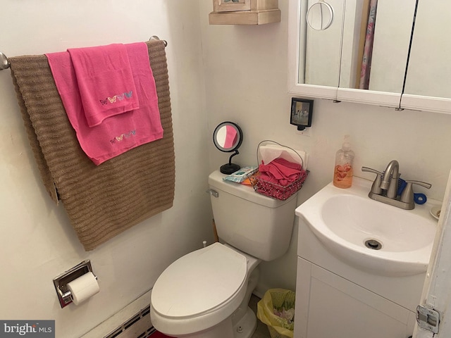 10092 Fay Ave, Seaford, DE 19973 - bathroom featuring vanity, baseboard heating, and toilet