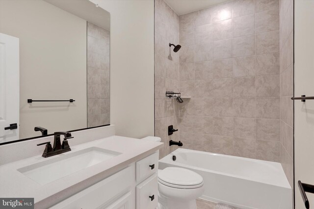 full bathroom with toilet, vanity, and shower / bathtub combination