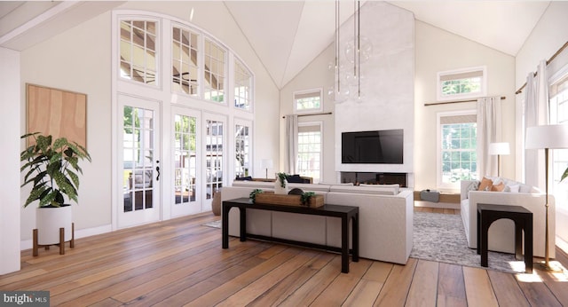 living area featuring high vaulted ceiling, baseboards, french doors, and light wood finished floors