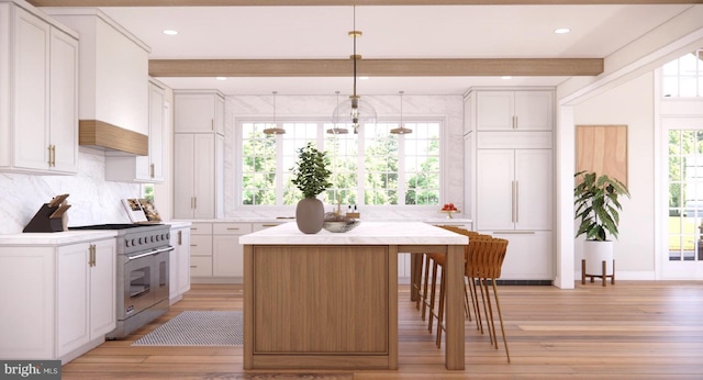 kitchen with beam ceiling, stainless steel stove, light wood-style floors, light countertops, and tasteful backsplash