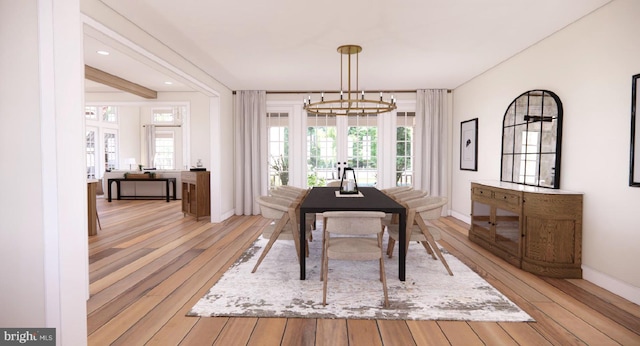 dining room featuring recessed lighting, baseboards, a notable chandelier, and light wood-style flooring