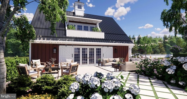 back of house featuring a standing seam roof, board and batten siding, outdoor lounge area, and french doors