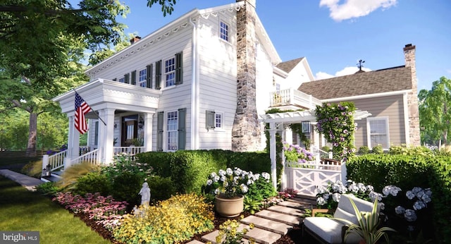 view of property exterior featuring a chimney and a balcony