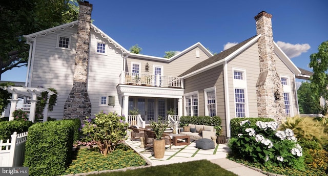 rear view of house with a pergola, a chimney, outdoor lounge area, and a balcony