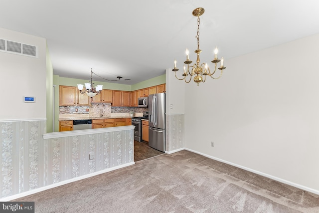 493 Stoneglen St, Collegeville, PA 19426 - kitchen with visible vents, a chandelier, a sink, carpet, and appliances with stainless steel finishes