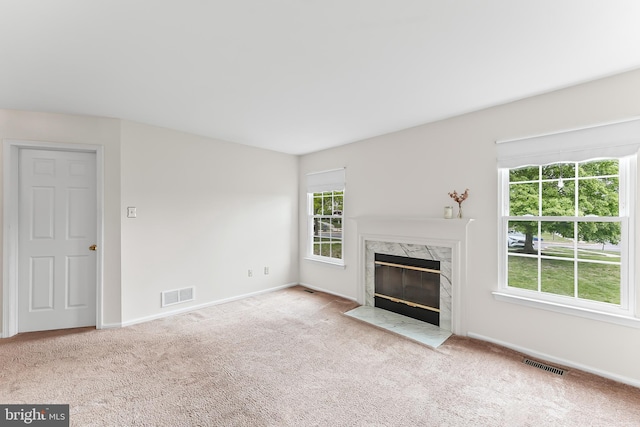 493 Stoneglen St, Collegeville, PA 19426 - unfurnished living room featuring carpet floors, baseboards, and visible vents