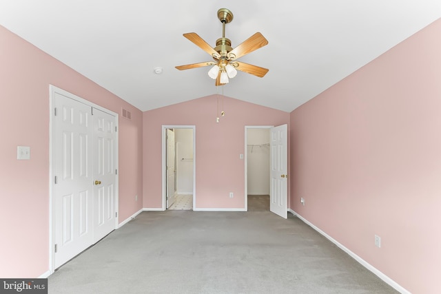 493 Stoneglen St, Collegeville, PA 19426 - unfurnished bedroom with light carpet, visible vents, baseboards, vaulted ceiling, and a closet