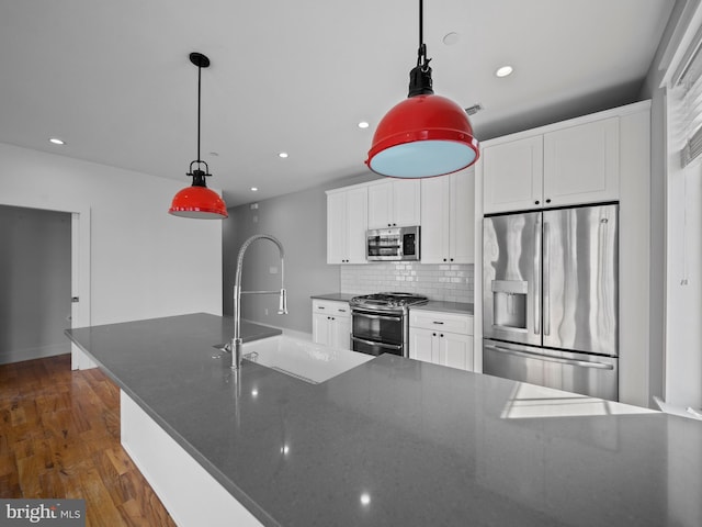 106-12 W Jefferson St Unit 2, Philadelphia, PA 19122 - kitchen featuring recessed lighting, a sink, decorative backsplash, white cabinets, and appliances with stainless steel finishes