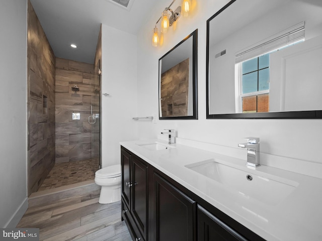 106-12 W Jefferson St Unit 2, Philadelphia, PA 19122 - full bath with a stall shower, toilet, a sink, and wood finished floors