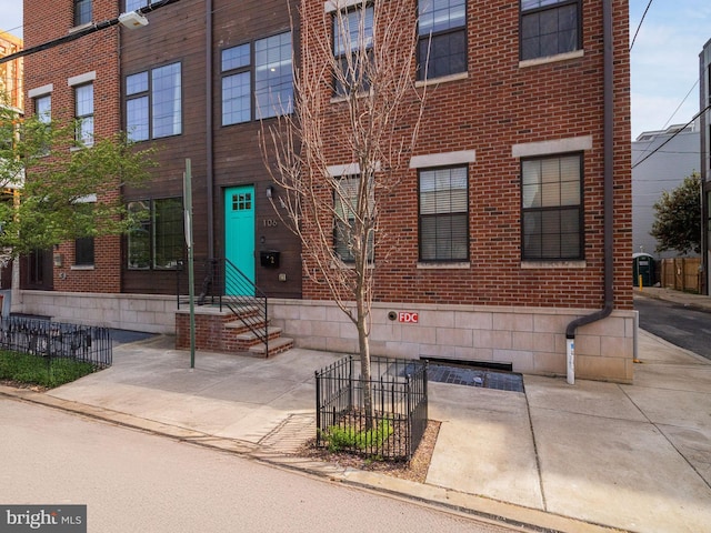 106-12 W Jefferson St Unit 2, Philadelphia, PA 19122 - view of front of property with fence and brick siding